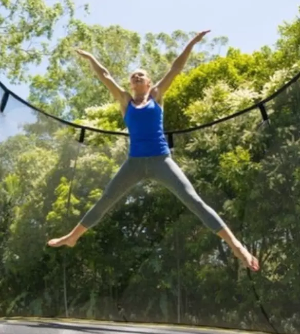 Star jump on a Springfree Trampoline