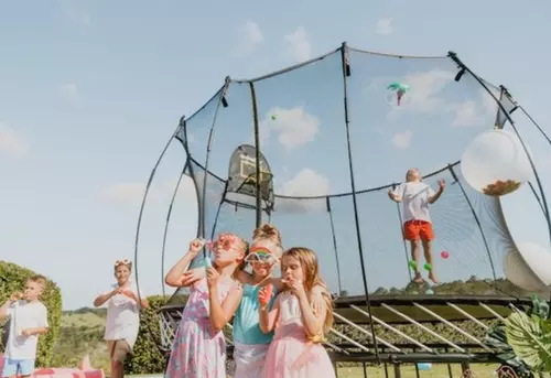 Kids jumping on a Springfree Trampoline